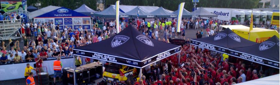 crowded event with canopy