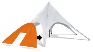 A white star tent with a conical roof is set up, partially sheltering an orange tent being moved underneath. The tents are pitched on a flat surface, offering an inviting space for gathering.