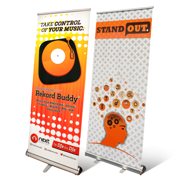 Two custom retractable banners: one spotlights Rekord Buddy DJ software with a vinyl record design; the other, adorned with a brain and musical icons, emphasizes the phrase Stand Out.
