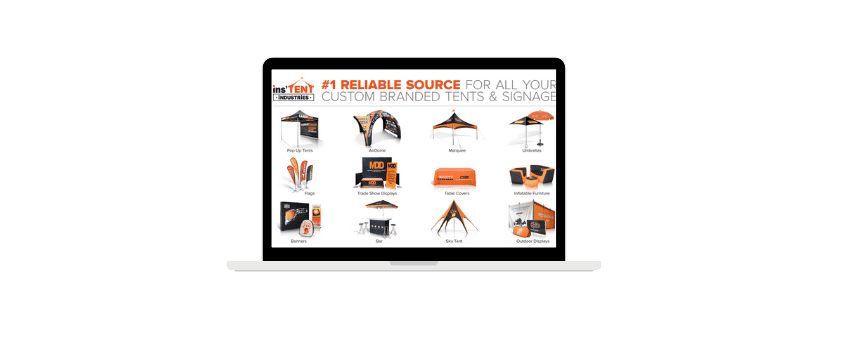 A laptop screen displaying a webpage with the title #1 Reliable Source for All Your Custom Branded Tents & Signage. Various tent and signage products are showcased, including flags, banners, and canopies in orange and black.