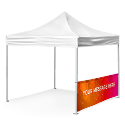 A white canopy tent with a vibrant orange and pink banner hanging on its side that reads YOUR MESSAGE HERE. The tent has a peaked roof and is supported by four metal poles.