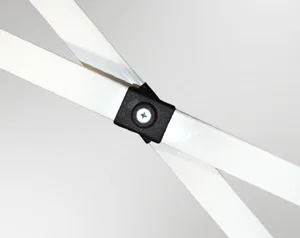 Close-up of a black plastic joint connecting two white metal beams in an X shape, reminiscent of the sturdy frame found in a 10 x 10 pop up canopy tent, with a visible screw centered. The background is a plain light gray.