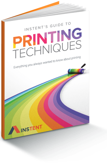 Book cover titled "Instents Guide to Printing Techniques," with a colorful paint roller creating a rainbow path, reminiscent of the vibrant design you'd find on a 10 x 10 canopy. Subtitle reads, "Everything you always wanted to know about printing.