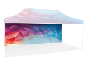Product Description: The 20' Printed Canopy Wall / Railskirt showcases a vibrant geometric design. The canopy displays a gradient of red, pink, purple, and blue polygonal patterns that extend seamlessly to the sidewall, all supported by sturdy metal poles.
