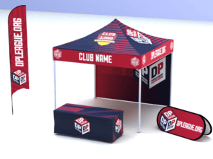 A display setup using the STARTER Package: DPL + Custom Club Name, which includes a red and blue canopy tent with the Club Name printed on it, accompanied by a matching table cover, a vertical flag, and a horizontal banner stand, all branded with OPLEAGUE.ORG and a cube logo.