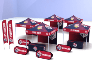A display features multiple red and blue pop-up tents adorned with customizable Club Name text and logos. Surrounding signs and banners prominently showcase the FIELD Package: DPL Logo ONLY branding from opleague.org, all arranged on a light-colored surface.