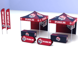 The TEAM Package: DPL Logo ONLY promotional outdoor setup includes two red and black tents, rectangular tables with matching covers, vertical flags, and oval signs featuring the DPLEAGUE.ORG logo and branding.