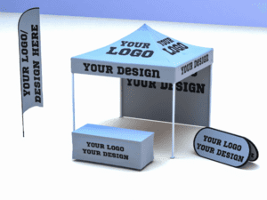 Introducing the STARTER Package: Full Customization, featuring a white canopy tent with your logo or design prominently printed on both the roof and sides. Includes a matching table cover and feather flag showcasing identical text. A small horizontal sign is also positioned beside the table.