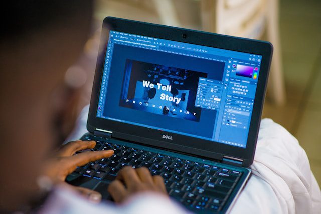 person with black laptop