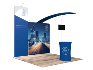 Introducing the 10'x10' Quick-N-Fit Booth - Package #1103: This trade show booth is designed with a blue and white theme, featuring striking cityscape graphics and a prominently displayed logo. The setup includes a towering display panel, a compact round counter, and an adjustable monitor stand. Plus, the floor boasts a chic wood-like finish.