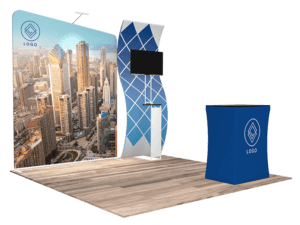 Introducing the 10'x10' Quick-N-Fit Booth - Package # 1106: This trade show setup includes a large backdrop adorned with a cityscape image and your logo, complemented by a curved panel equipped with a screen. Additionally, it features a rectangular kiosk showcasing the matching logo, all elegantly arranged on a wooden floor panel.
