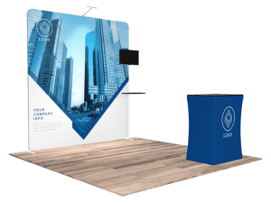 Introducing the 10'x10' Quick-N-Fit Booth - Package #1109: This trade show booth features a spacious backdrop adorned with a striking cityscape and prominently displays your logo. In front, a coordinated table also showcases the logo, while the backdrop's text area allows for Your Company Info to be included. The entire setup is showcased on an elegant wooden floor.
