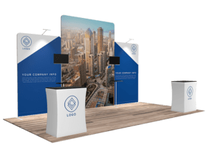 Experience the 10'x20' Quick-N-Fit Booth - Package #1212, showcasing a cityscape backdrop with three panels. The design features a blue and white color scheme, complete with your logo on the panels and counters. It includes text boxes for company information and two screens mounted on stands for an engaging trade show presence.