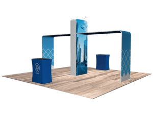 Introducing the 20'x20' Quick-N-Fit Booth - Package # 2201: a trade show display showcasing a sleek modern design with a central tower adorned with a cityscape. The booth includes two blue stands featuring a geometric logo, set on an elegant wooden floor. An archway links the tower and stands, forming an open and welcoming environment.
