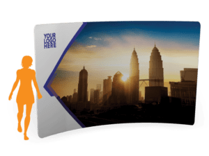 A silhouette walks beside the 10x 7.5 Tension Wall w/ Hardware - Straight,” featuring a sunset cityscape with skyscrapers and a logo space in the top left corner.