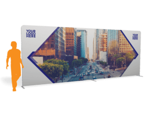 The 20x 7.5 Tension Wall w/ Hardware - Straight has a cityscape showing tall buildings and a busy street, featuring two triangular frames on the sides and YOUR LOGO HERE text in the top corners. An orange silhouette stands to the left for scale.