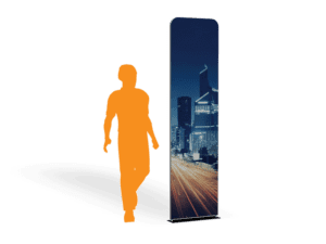 Silhouette of an orange person walking next to a tall, rectangular display featuring a cityscape with skyscrapers and blurred lights at night. The background is plain white.