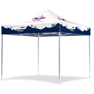 The BSA 10x10 Custom Printed Tent features a white pop-up canopy with outdoor-themed graphics, blue hiker and tree silhouettes, and red and blue logos on top. It has four white legs and casts a shadow on the ground.