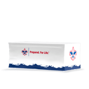 A rectangular table is adorned with a Fitted Table Cover - Fully Printed showcasing the Boy Scouts of America logo and Prepared. For Life. in red and blue, with a blue design along the bottom edge.