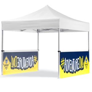 A white outdoor tent with two side banners—Cub Scouts - 10 Railskirt (Set of 2) - Cub Scouts Logo (Copy)—featuring #AdventureOn! in blue and yellow. The left banner shows the text in reverse, with a small wolf icon logo included.