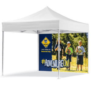 A white outdoor canopy tent wall named Cub Scouts - 10 Tent Wall - Cub Scouts Logo (Copy) features a banner with three children in scout uniforms on grass, the scout logo, the text Join today at beascout.org, and #ADVENTUREON! in bold letters.