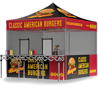 A pop-up food stall with a black and red canopy and banners reading Classic American Burgers, decorated with burger graphics. The stall has counters for serving food and condiment bottles on display.