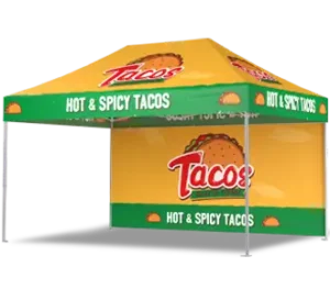A yellow and green pop-up tent with Tacos and Hot & Spicy Tacos printed on it, along with images of tacos. The tent has a taco graphic and text on both the roof and sides.
