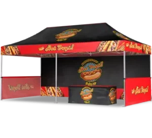 A red and black pop-up food tent with Hot Dogal! branding, featuring images of hot dogs and a large logo on the canopy, table, and side panels.