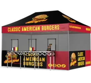 A black and red food stall tent labeled Classic American Burgers with a burger logo, serving counter, condiment bottles, and a menu stand at the front.
