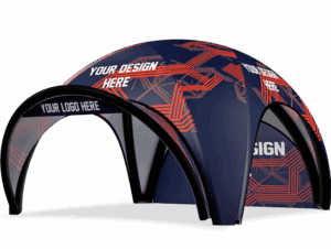 The 26x26 Printed Inflatable Air Dome Tent features a bold blue and red geometric design with customizable areas labeled “YOUR DESIGN HERE” and “YOUR LOGO HERE” on its panels and entrance.