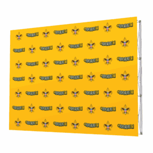 A yellow step-and-repeat backdrop featuring repeating patterns of a cartoon fox head and the hashtag #ADVENTUREDON in green and white text. The logos are arranged in a grid pattern across the background.