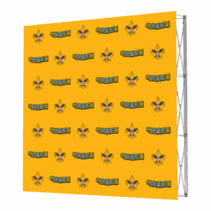 A yellow step and repeat banner featuring a repeating pattern of a cartoon wolf wearing a yellow scout hat and the hashtag #ADVENTUREON! in bold black letters. The banner is supported by a metal frame.