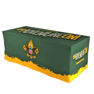 A green and yellow table cover featuring the Boy Scouts of America fleur-de-lis emblem and the phrase #ADVENTUREON! along with the website beascout.org.