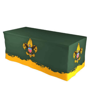 A green tablecloth with yellow trim features large Boy Scouts of America fleur-de-lis emblems on the front and sides.