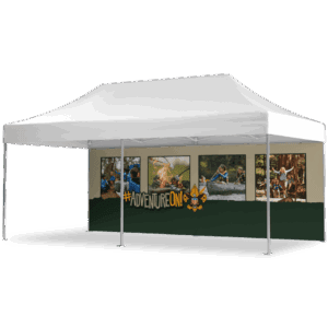 A white canopy tent with a printed backdrop showing four photos of kids doing outdoor activities, plus the words #AdventureOn! and a fleur-de-lis symbol at the bottom.