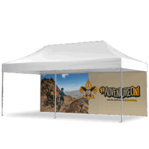 A white canopy tent with a side banner showing two people mountain biking on rocky terrain and the text #ADVENTUREON! Join the adventure at beascout.org with a fleur-de-lis scouting emblem.