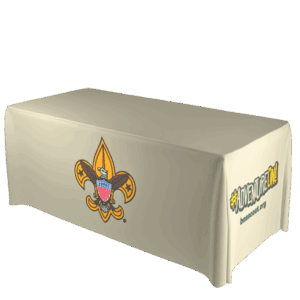 A beige tablecloth covers a rectangular table, featuring the Boy Scouts of America emblem on the front and the text #ADVENTUREON! beascout.org on the side.