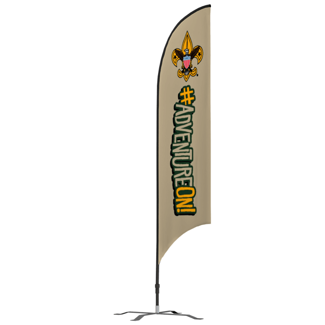 A beige vertical flag with the Boy Scouts fleur-de-lis logo at the top and large text reading #ADVENTUREON! in green and yellow, standing on a metal base.