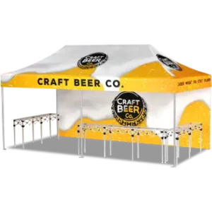 A yellow and white canopy tent with Craft Beer Co. branding and logo, set up with several tables underneath, likely for serving drinks at an event or festival.