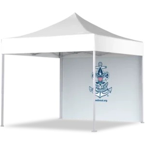 A white outdoor canopy tent with a peaked roof and a back wall displaying a nautical-themed Sea Scout logo featuring an anchor, ship wheel, fleur-de-lis, and the text “SeaScout.org.”.