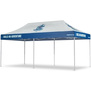 A blue and white outdoor canopy tent with the phrase BUILD AN ADVENTURE printed on the side panels and a nautical logo on the roof. The tent is supported by six metal legs.