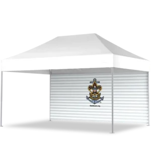 A white outdoor canopy tent with a corrugated metal wall at the back, featuring an anchor and shield logo with an eagle and the text SeaScout.org on the wall.