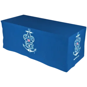 A rectangular blue tablecloth featuring the Sea Scouts emblem, which shows an anchor and a fleur-de-lis with a red, white, and blue eagle shield in the center, draped over a table.