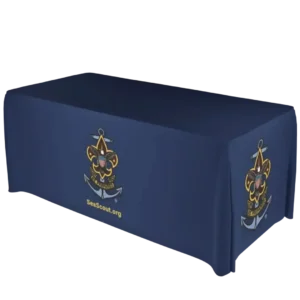 A navy blue tablecloth covers a rectangular table, featuring the Sea Scouts emblem and the text SeaScout.org on the front and side.