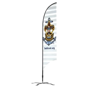 A sign with the Sea Scouts emblem, featuring an anchor and a fleur-de-lis with the word “Be Prepared.” Below the emblem is the website “SeaScout.org.” The background is white with light gray horizontal stripes.