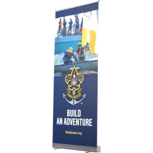 A promotional Sea Scouts banner shows youth in life jackets paddling and climbing onto a boat, with the Sea Scouts emblem and the slogan Build an Adventure along with the website SeaScout.org.