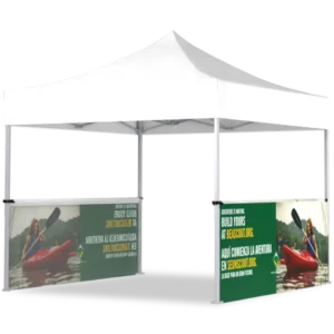 A white outdoor canopy tent with green banners featuring a person kayaking and text in English and Spanish promoting adventure tours. The tent has open sides and the banners are attached to two corners.