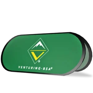 A green display sign featuring the Venturing BSA logo—an abstract mountain above a yellow V in a diamond shape—with the text Venturing BSA below it on a green background.