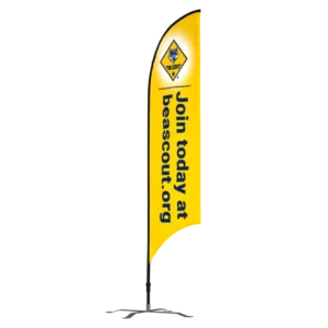 A yellow vertical flag with a Cub Scouts logo and text reading Join today at beascout.org in black letters. The flag is mounted on a black base.
