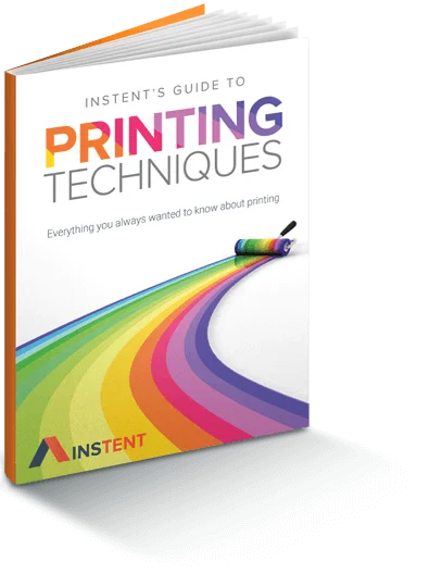 A book titled Instent’s Guide to Printing Techniques shows a roller creating a colorful rainbow path on the cover. The Instent logo appears at the bottom.